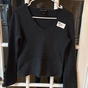 G61.    Black V-Neck Sweater